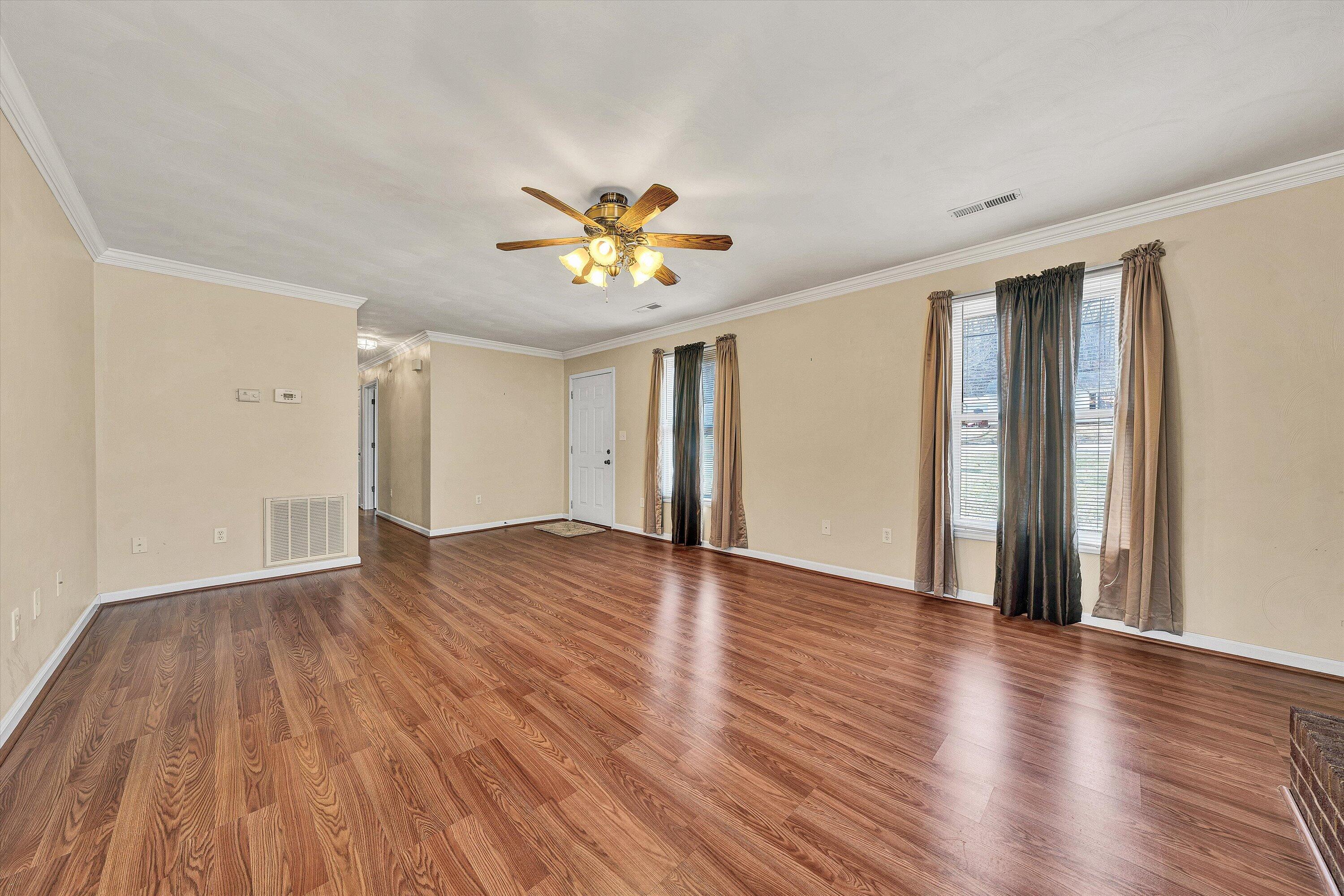 1060 Kessler Mill Road Salem, VA 24153 - Photo 3 of 31 a view of an empty room with wooden floor and a window