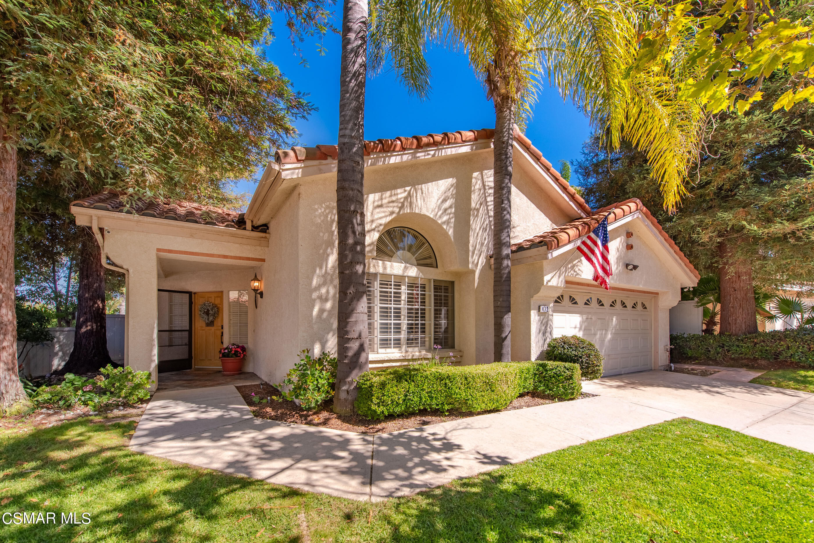472 Fresh Meadows Road Simi Valley, CA 93065 - Photo 1 of 33 a front view of a house with a yard and potted plants