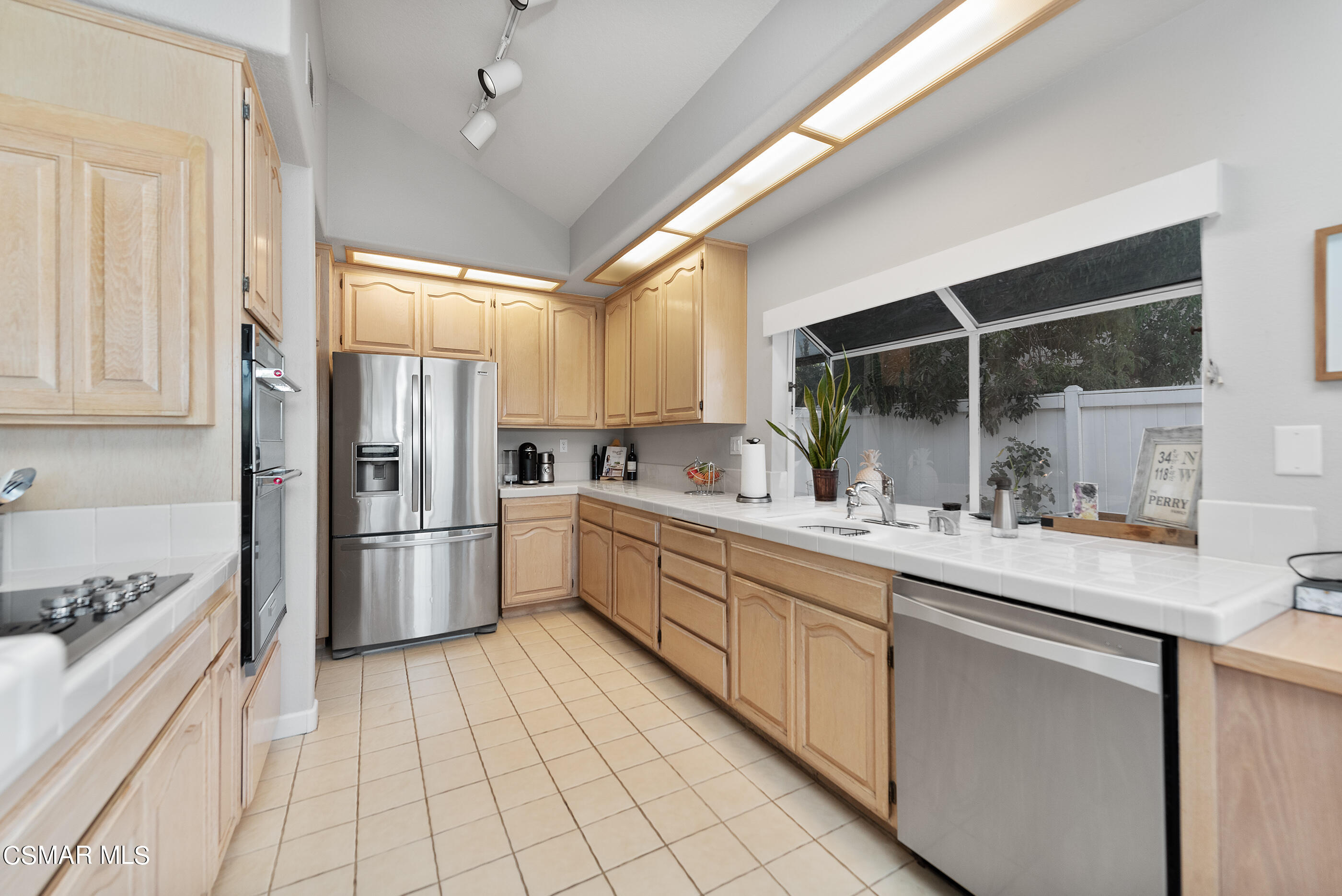 472 Fresh Meadows Road Simi Valley, CA 93065 - Photo 14 of 33 a kitchen with a sink appliances cabinets and a counter top space
