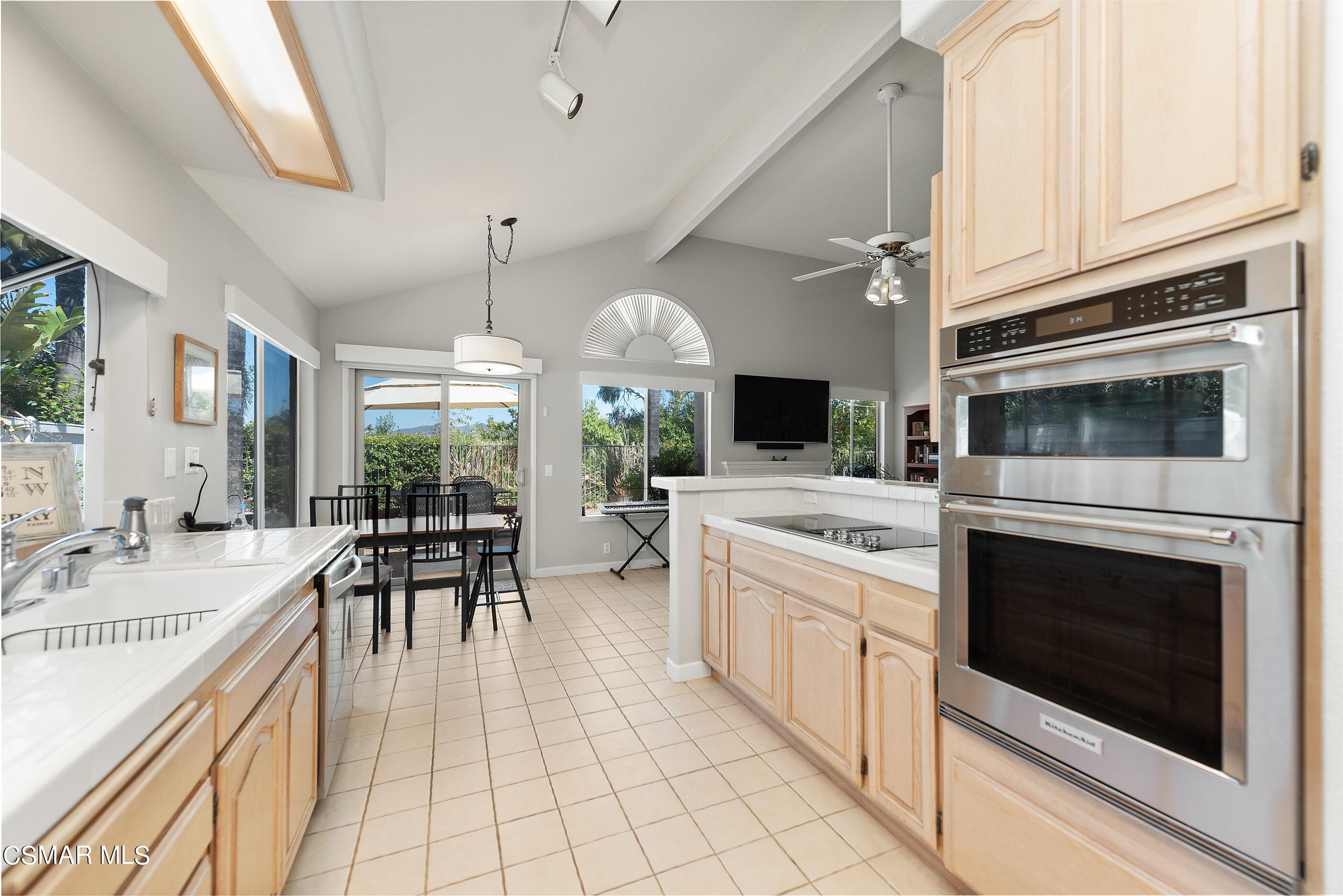 472 Fresh Meadows Road Simi Valley, CA 93065 - Photo 17 of 33 a kitchen with stainless steel appliances a stove a sink and a refrigerator