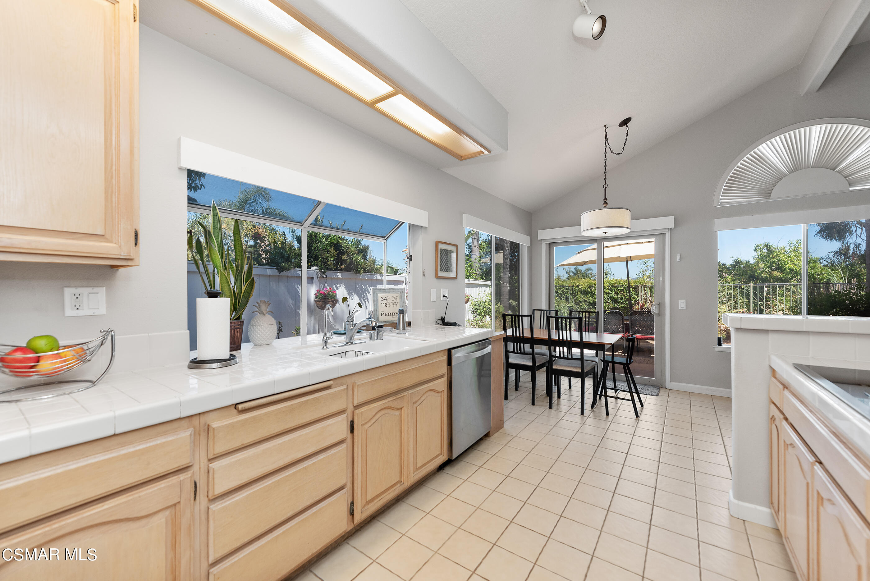 472 Fresh Meadows Road Simi Valley, CA 93065 - Photo 18 of 33 a kitchen with sink cabinets and dining table view