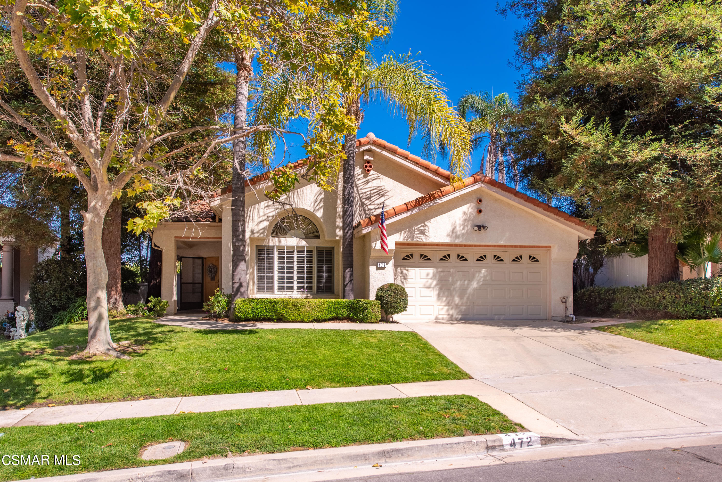 472 Fresh Meadows Road Simi Valley, CA 93065 - Photo 2 of 33 a front view of a house with a yard and potted plants