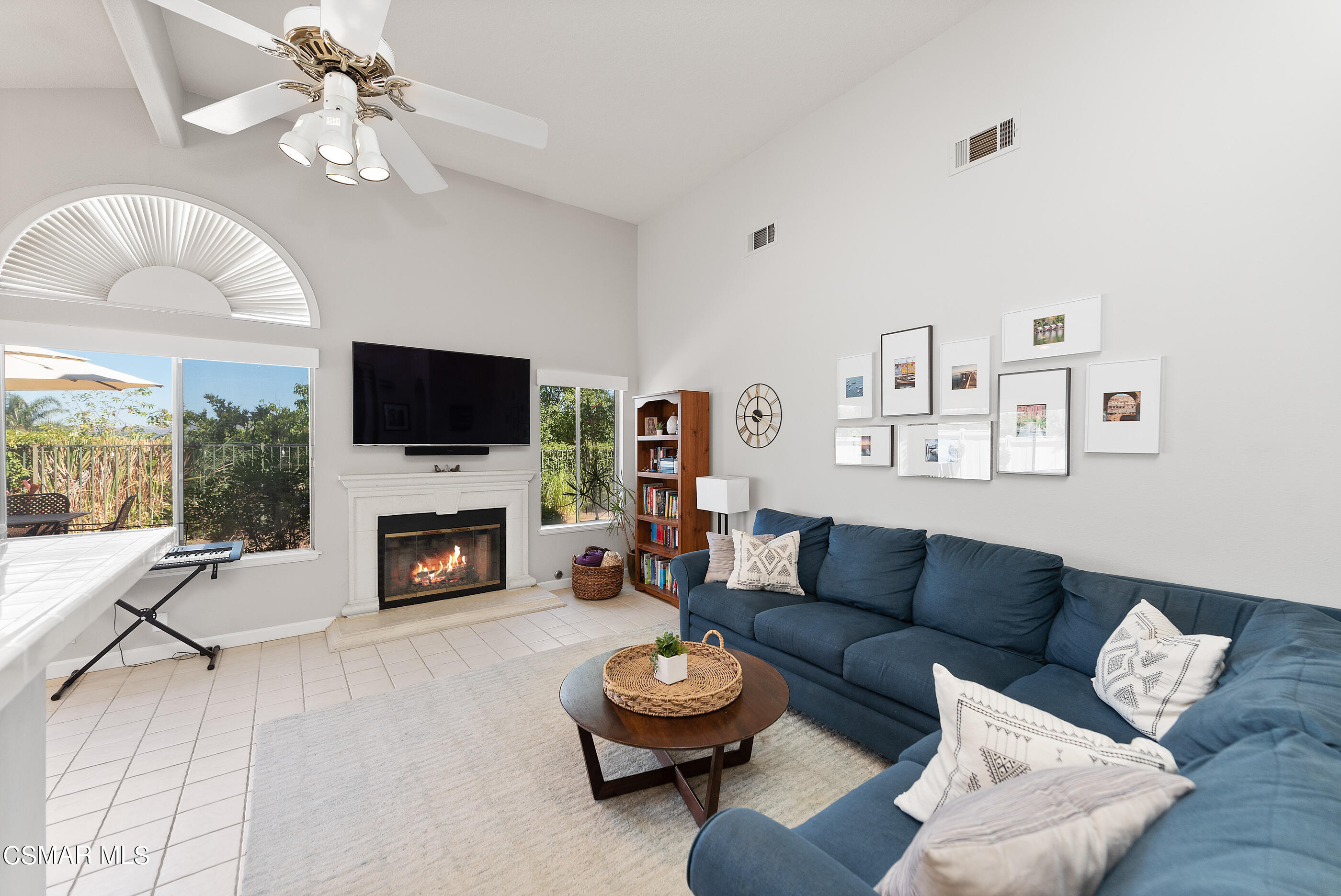 472 Fresh Meadows Road Simi Valley, CA 93065 - Photo 10 of 33 a living room with furniture a fireplace and a flat screen tv