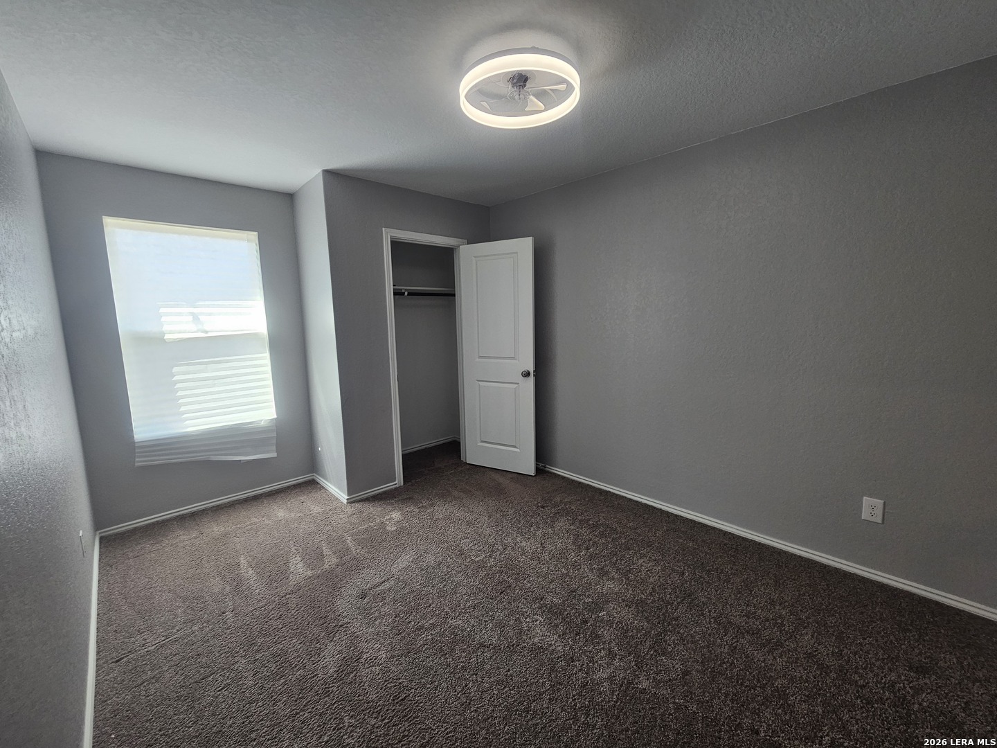6855 Burgess Ridge Converse, TX 78109 - Photo 12 of 24 an empty room with a window and closet area