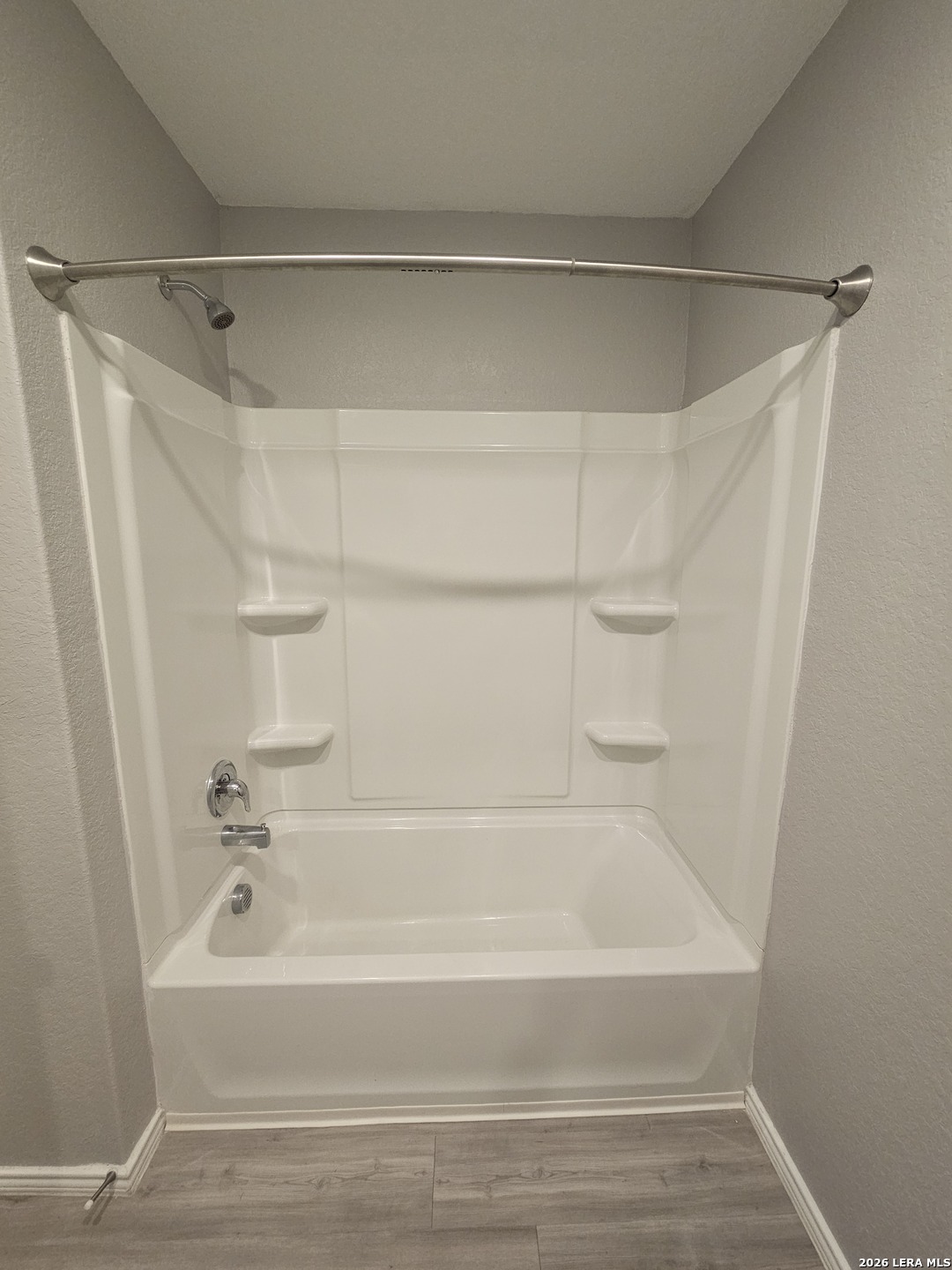 6855 Burgess Ridge Converse, TX 78109 - Photo 18 of 24 a bathroom with a shower and a bath tub