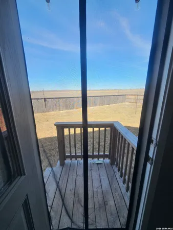 a view of balcony with wooden floor