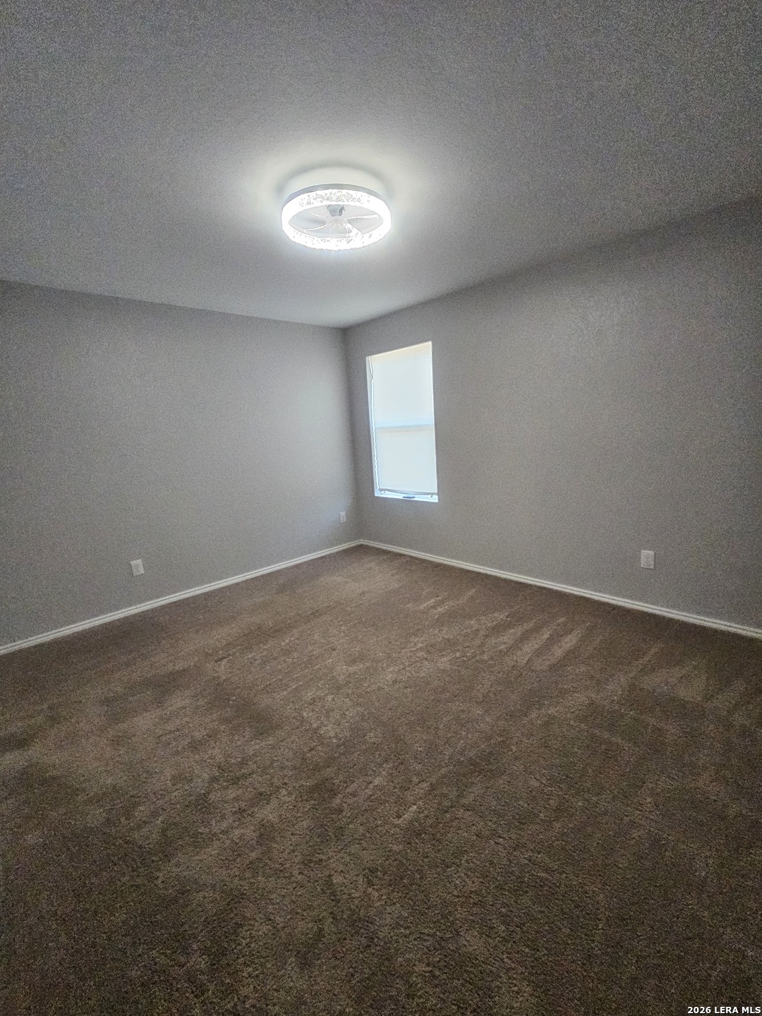 6855 Burgess Ridge Converse, TX 78109 - Photo 6 of 24 an empty room with a empty space and window