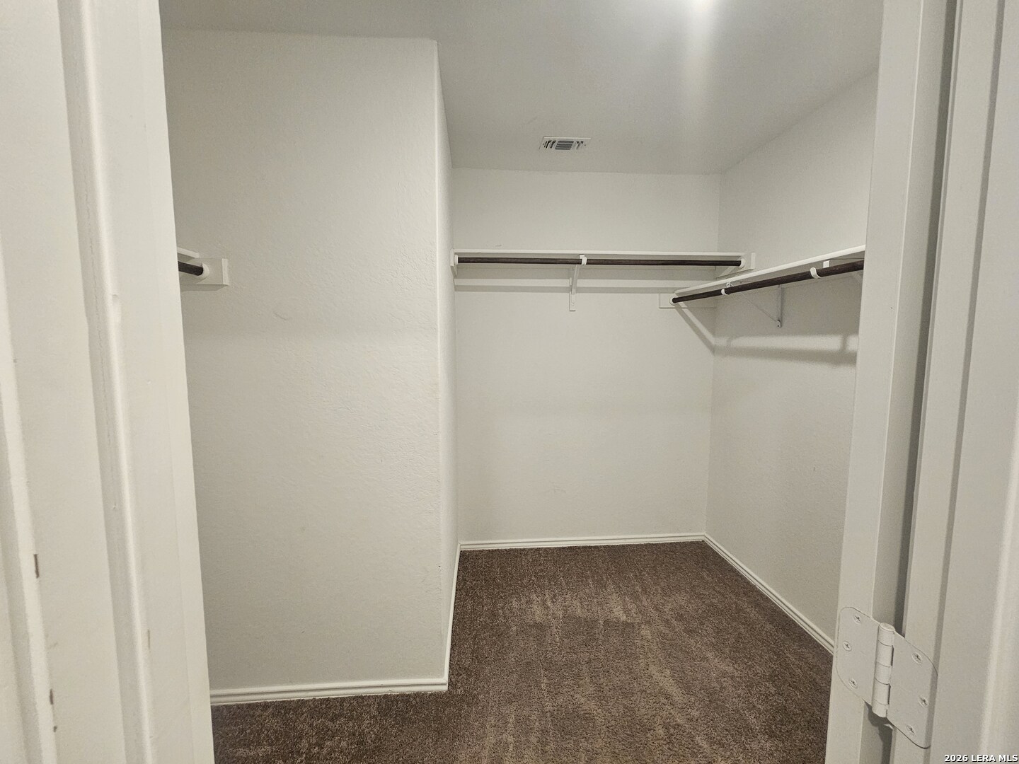 6855 Burgess Ridge Converse, TX 78109 - Photo 7 of 24 a view of small space with racks on the wall