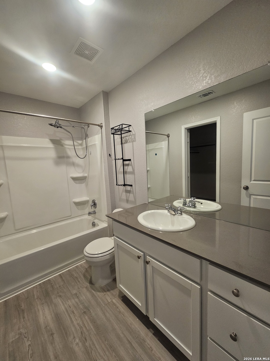 6855 Burgess Ridge Converse, TX 78109 - Photo 8 of 24 a bathroom with a granite countertop sink toilet and shower