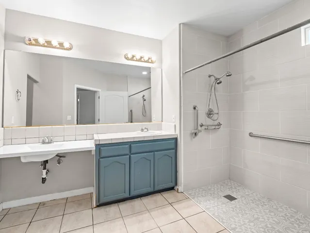 a bathroom with a shower and a shower