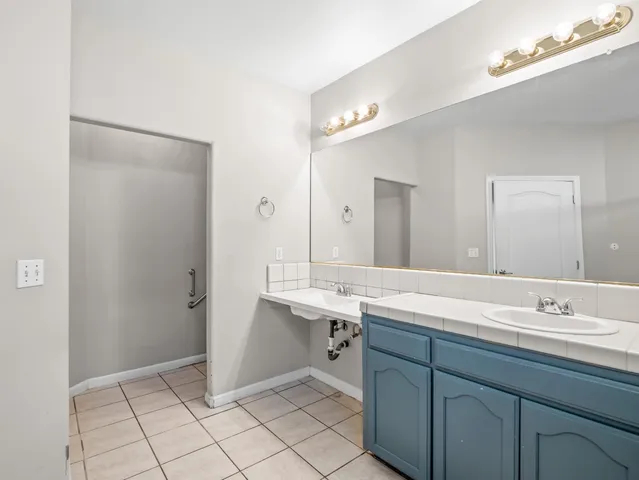 a view of a backyard with wooden fence