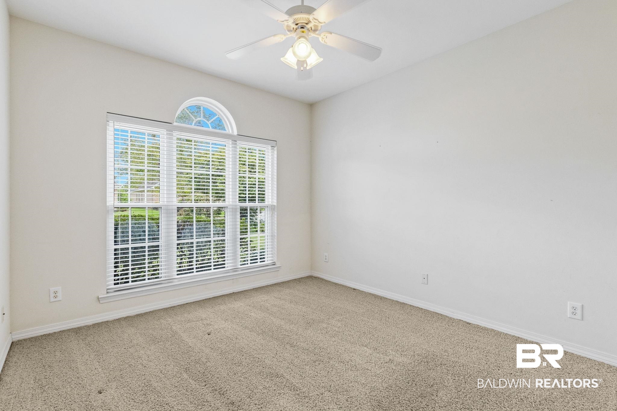 166 Club Drive Fairhope, AL 36532 - Photo 30 of 41 Empty room with ceiling fan and carpet floors