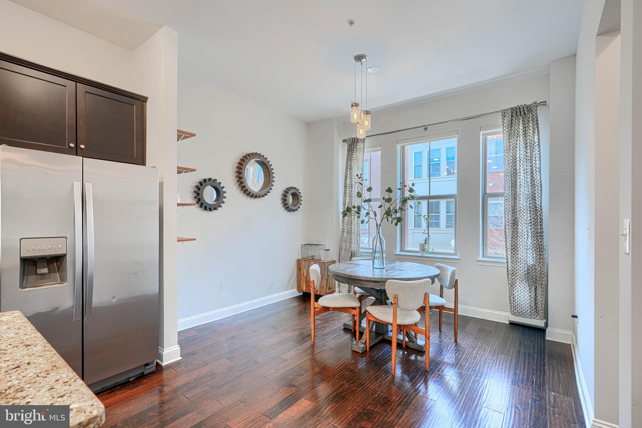 1309 Benjamin Street Baltimore, MD 21230 - Photo 18 of 60 a view of a dining room with furniture and wooden floor