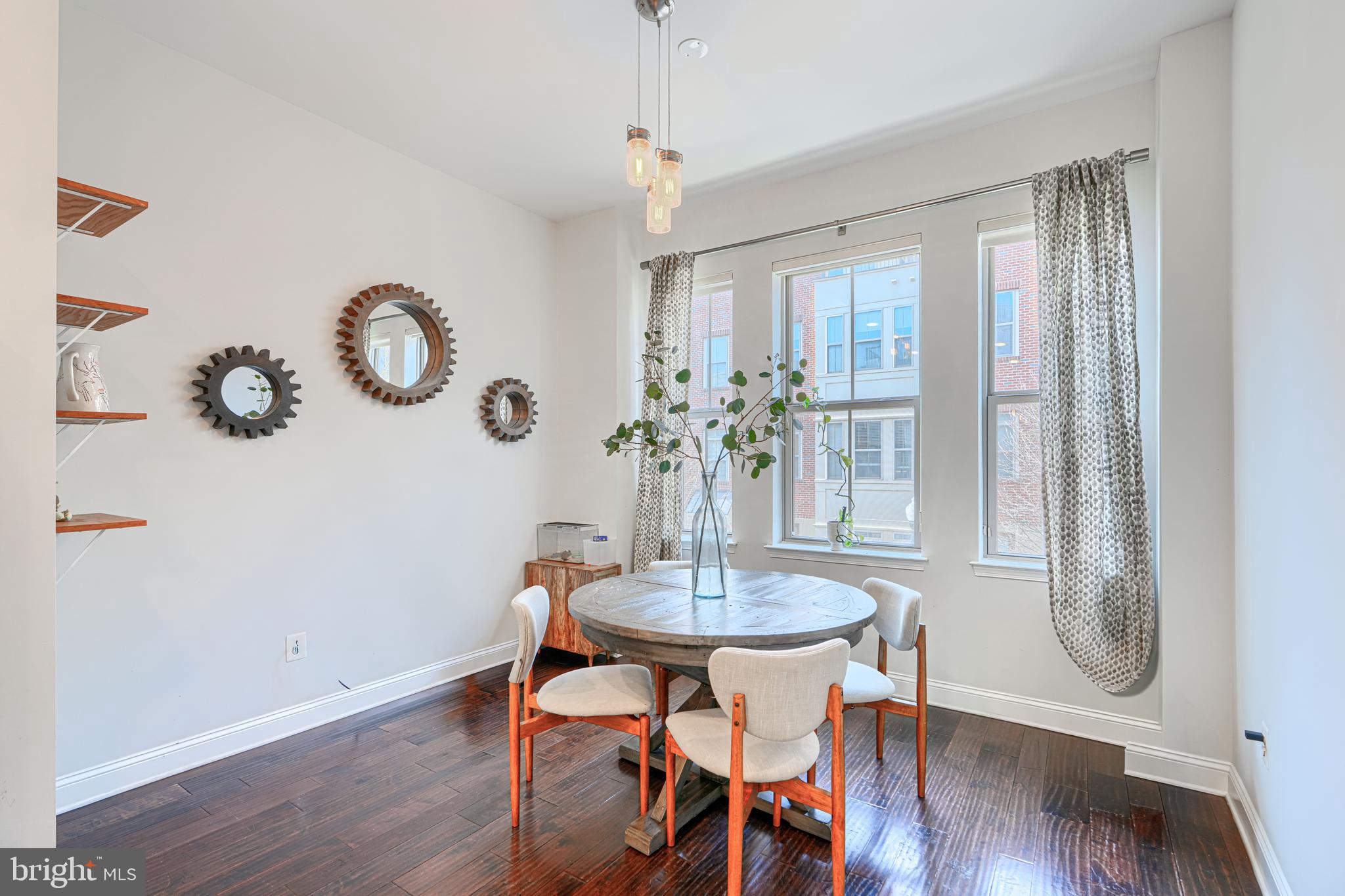 1309 Benjamin Street Baltimore, MD 21230 - Photo 19 of 60 a view of a dining room with furniture and wooden floor