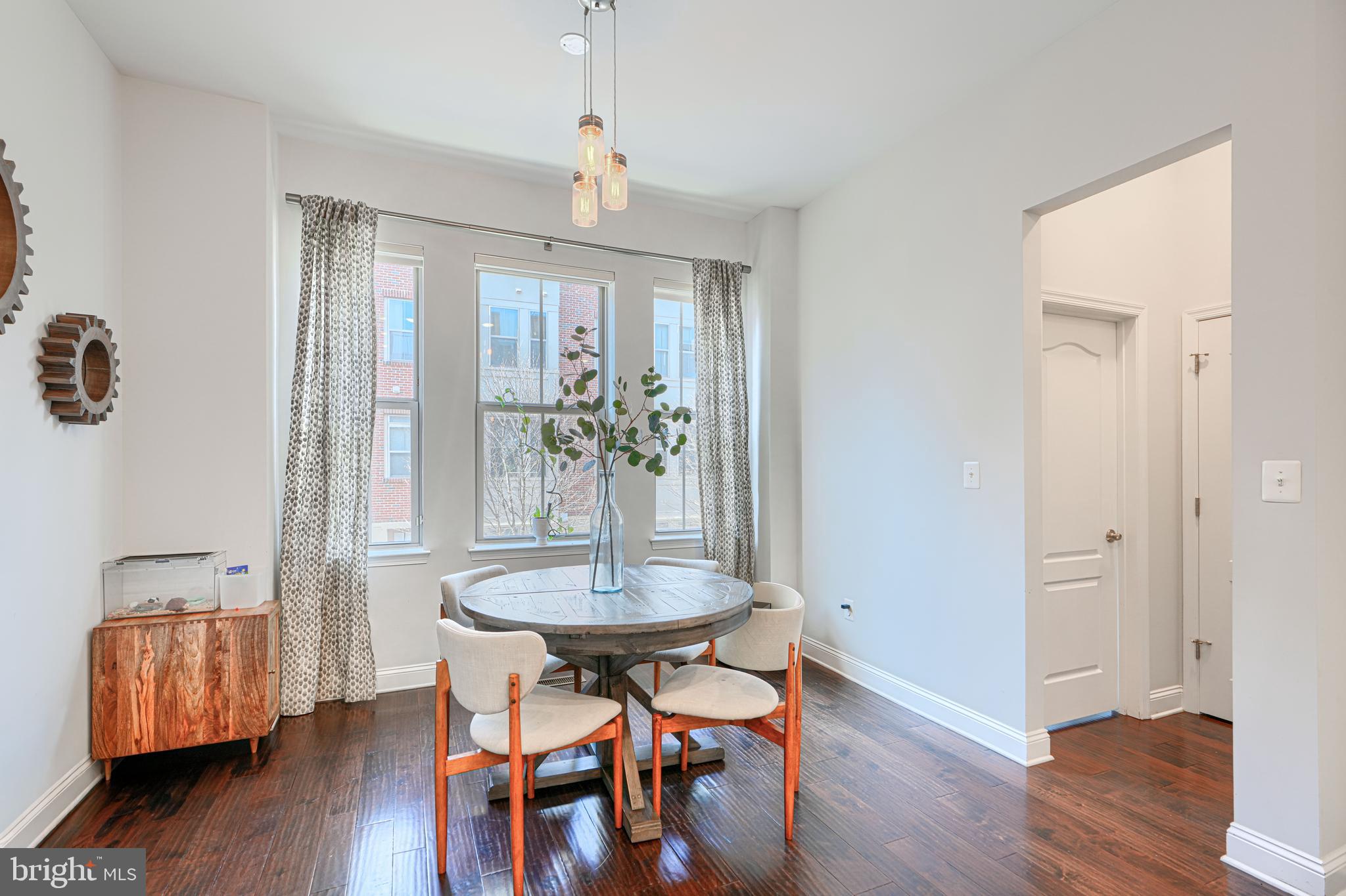 1309 Benjamin Street Baltimore, MD 21230 - Photo 20 of 60 a view of a dining room with furniture and wooden floor