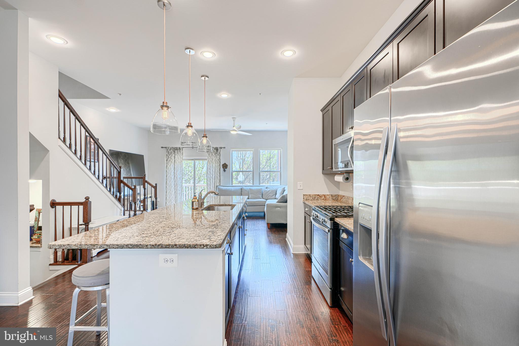 1309 Benjamin Street Baltimore, MD 21230 - Photo 24 of 60 a kitchen with stainless steel appliances granite countertop a refrigerator a stove and a sink