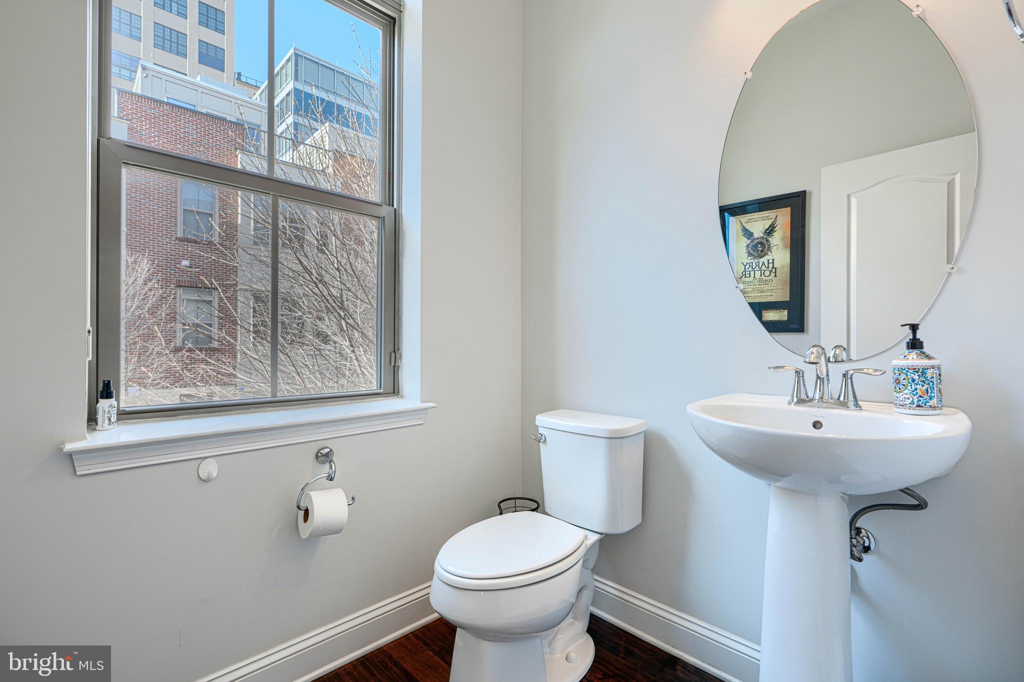 1309 Benjamin Street Baltimore, MD 21230 - Photo 29 of 60 a bathroom with a toilet sink and mirror