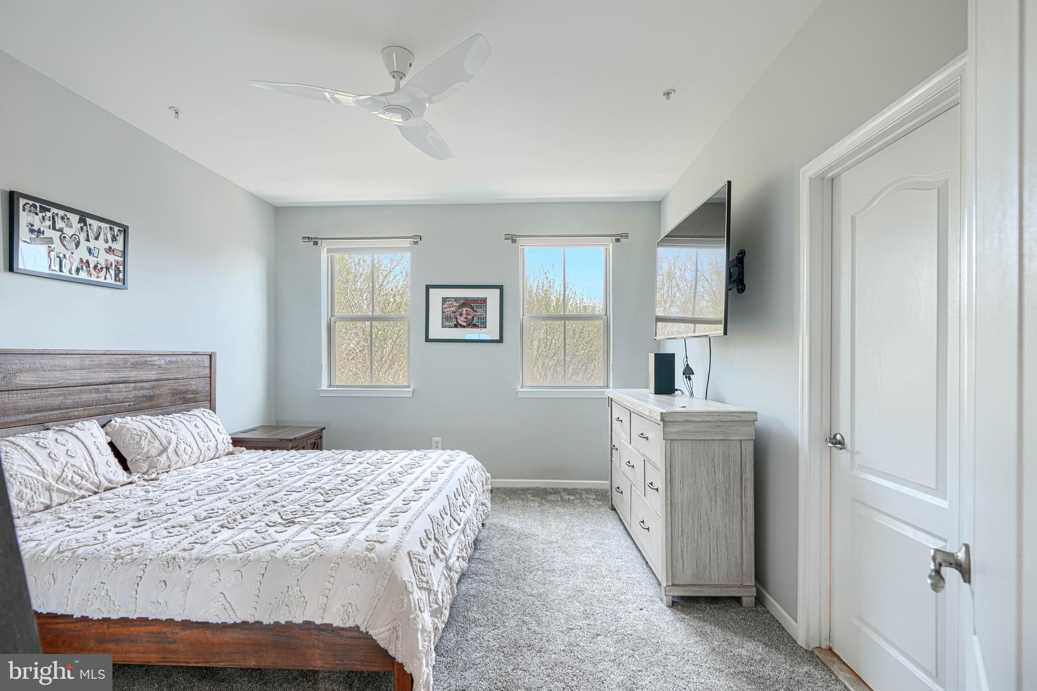 1309 Benjamin Street Baltimore, MD 21230 - Photo 43 of 60 a bedroom with a large bed and a chandelier