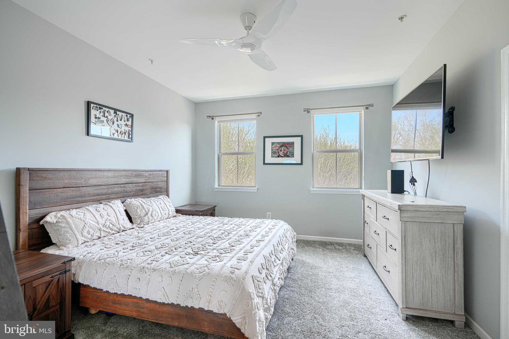 1309 Benjamin Street Baltimore, MD 21230 - Photo 44 of 60 a bedroom with a bed and a chandelier
