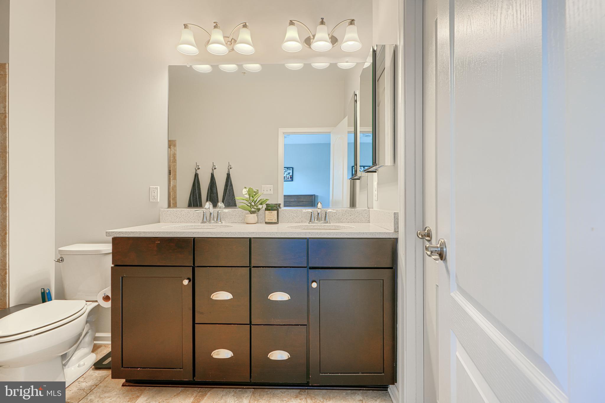 1309 Benjamin Street Baltimore, MD 21230 - Photo 47 of 60 a bathroom with a sink vanity and a mirror