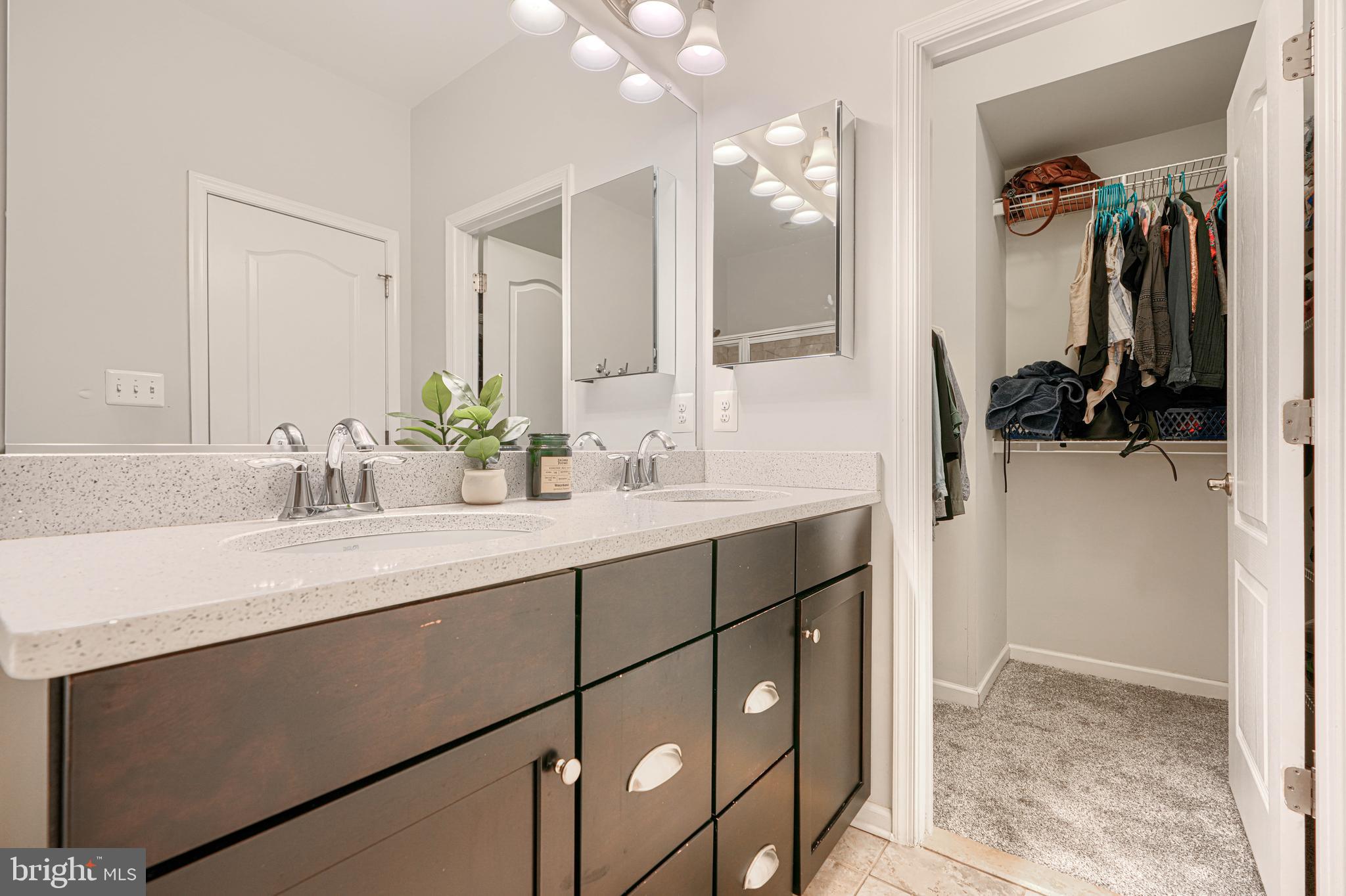 1309 Benjamin Street Baltimore, MD 21230 - Photo 49 of 60 a bathroom with a sink and a mirror