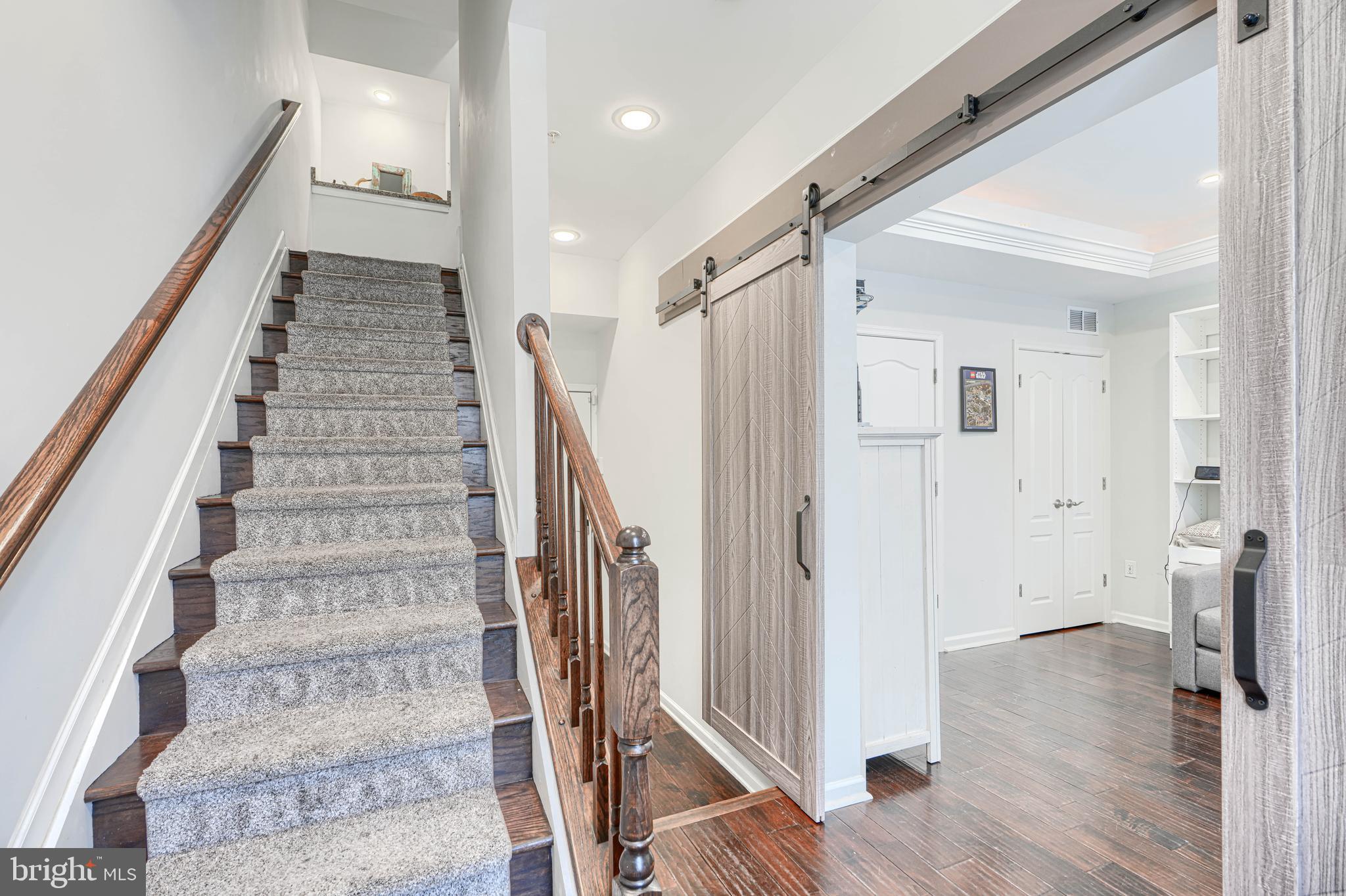 1309 Benjamin Street Baltimore, MD 21230 - Photo 5 of 60 a view of an entryway with wooden floor and staircase