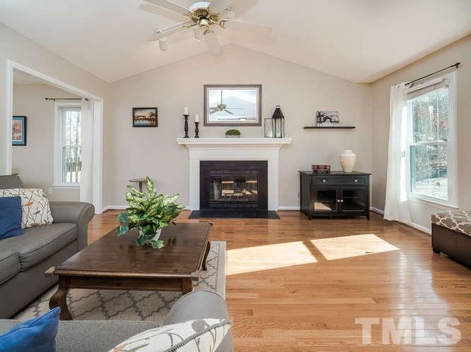 2312 Anihinga Court Raleigh, NC 27616 - Photo 2 of 25 a living room with furniture and a fireplace