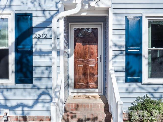 2312 Anihinga Court Raleigh, NC 27616 - Photo 23 of 25 a front view of a house with a glass door