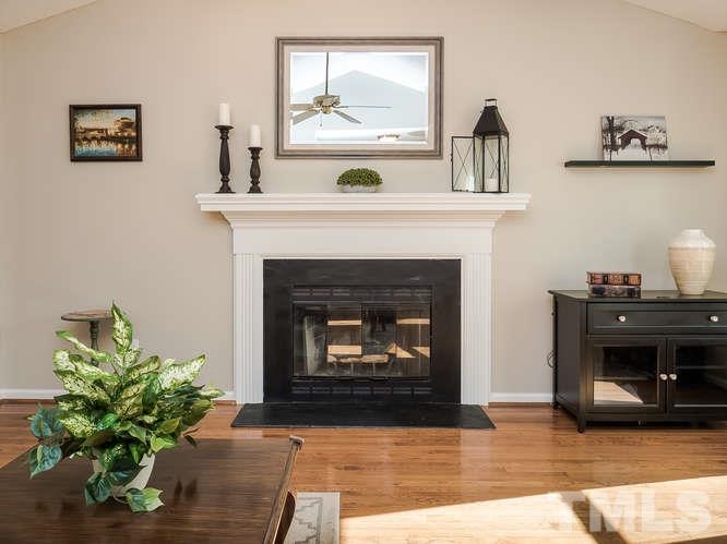 2312 Anihinga Court Raleigh, NC 27616 - Photo 5 of 25 a living room with furniture and a fireplace