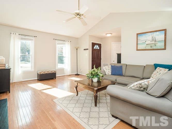 2312 Anihinga Court Raleigh, NC 27616 - Photo 7 of 25 a living room with furniture and wooden floor