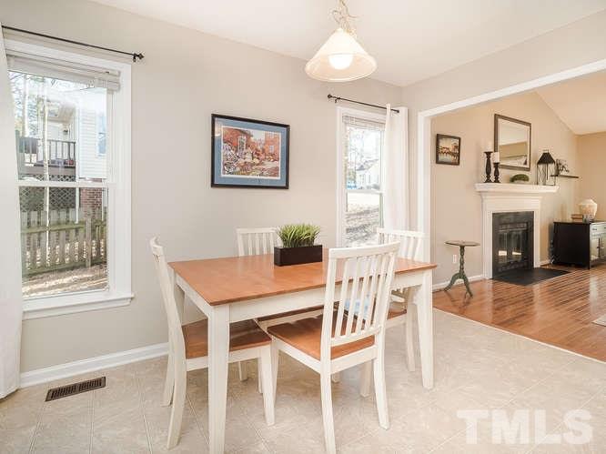 2312 Anihinga Court Raleigh, NC 27616 - Photo 10 of 25 a view of a dining room with furniture window and wooden floor