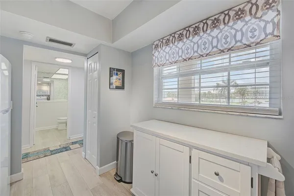a kitchen with appliances a sink and cabinets