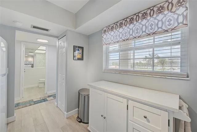 a kitchen with appliances a sink and cabinets