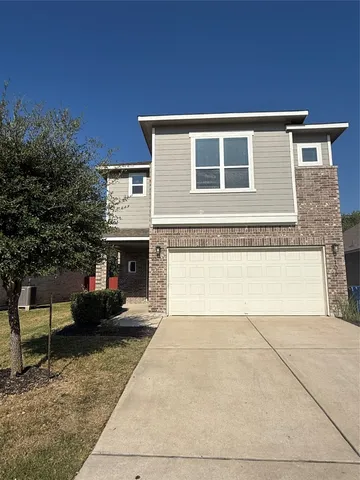 a front view of a house with yard