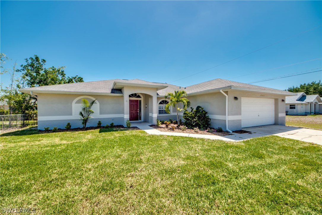 17517 Braddock Road Fort Myers, FL 33967 - Photo 1 of 33 a view of a house with backyard and garden