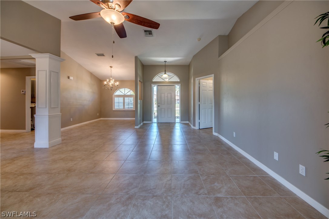 17517 Braddock Road Fort Myers, FL 33967 - Photo 13 of 33 an empty room with chandelier fan and windows