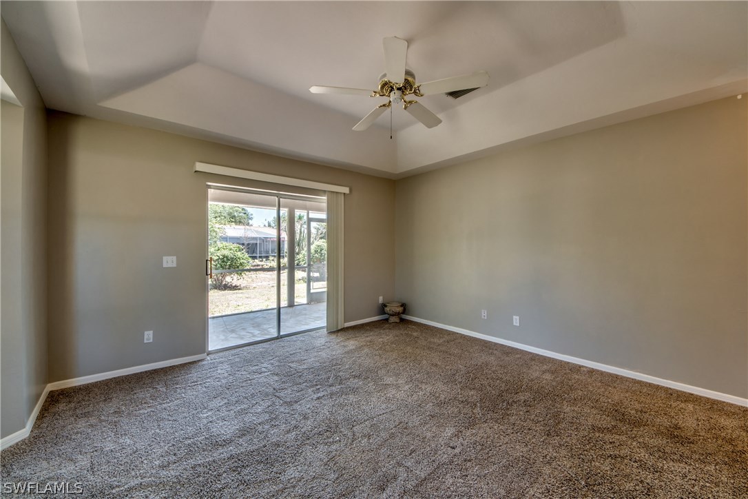 17517 Braddock Road Fort Myers, FL 33967 - Photo 20 of 33 an empty room with windows and fan