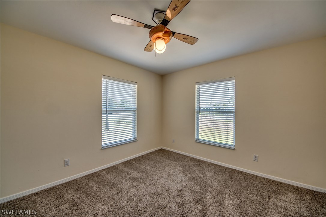 17517 Braddock Road Fort Myers, FL 33967 - Photo 25 of 33 a view of an empty room with a window