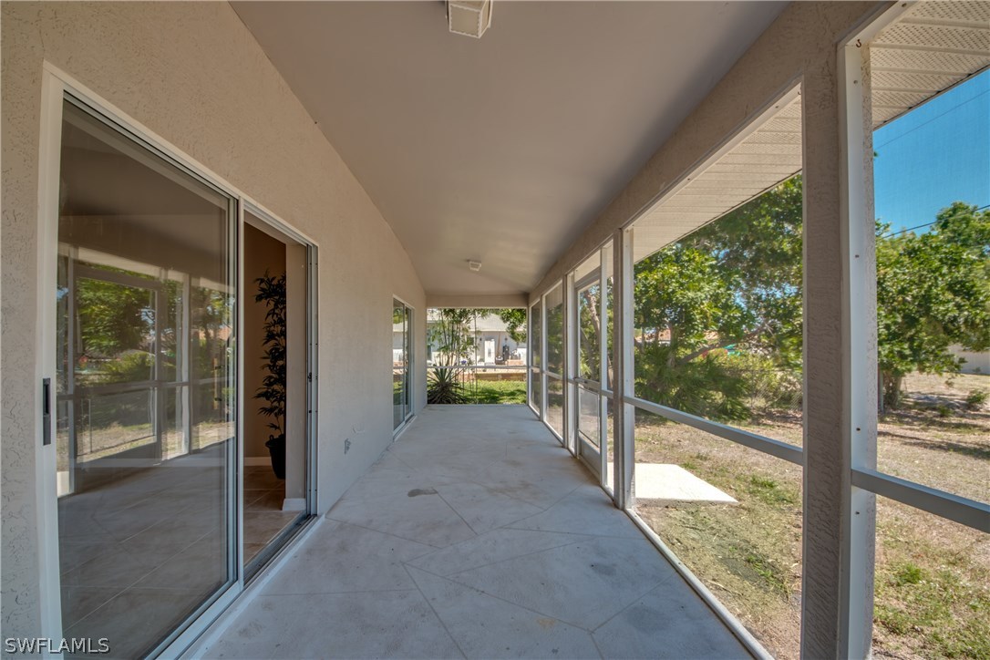 17517 Braddock Road Fort Myers, FL 33967 - Photo 30 of 33 a view of a porch with wooden floor and outdoor space