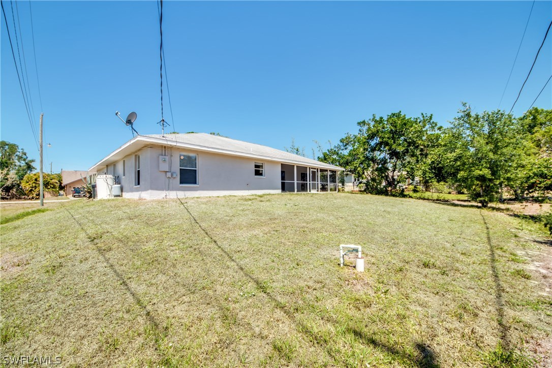 17517 Braddock Road Fort Myers, FL 33967 - Photo 33 of 33 a view of a house with a yard