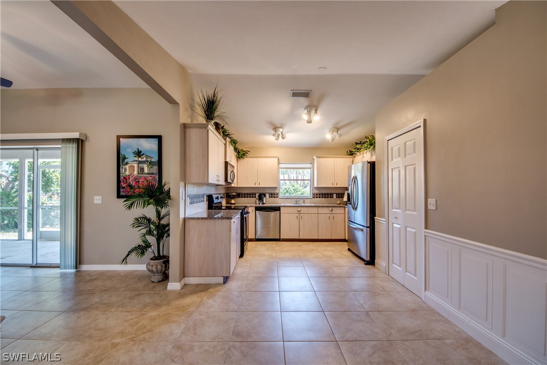 17517 Braddock Road Fort Myers, FL 33967 - Photo 6 of 33 a kitchen with a refrigerator and a refrigerator