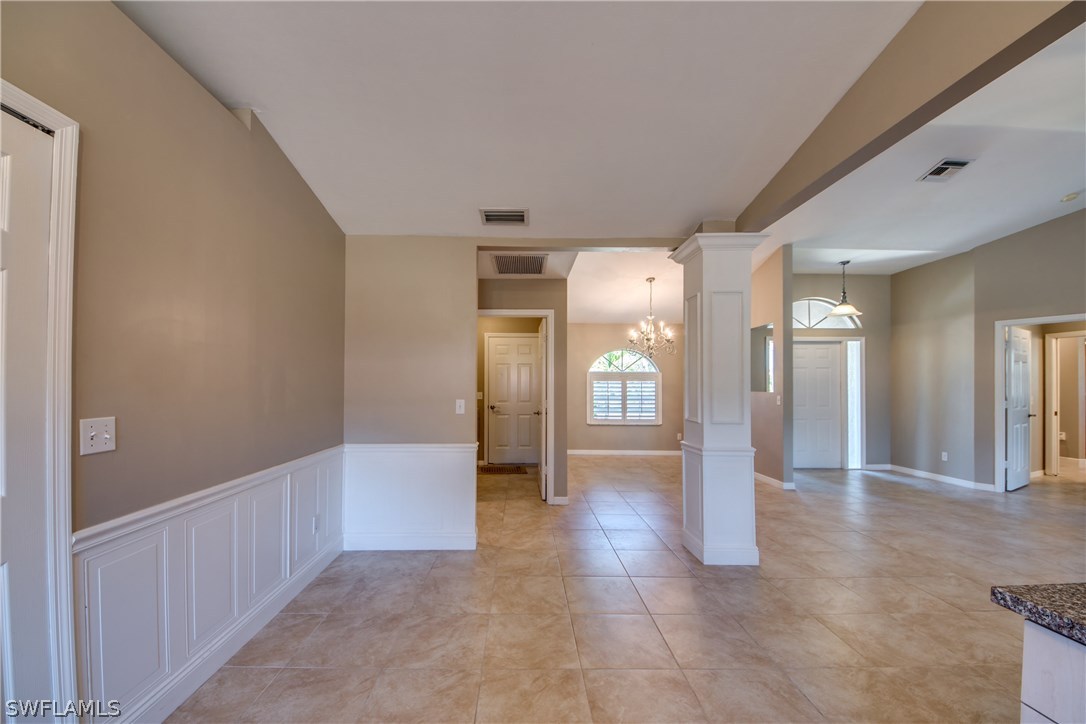 17517 Braddock Road Fort Myers, FL 33967 - Photo 8 of 33 a view of a hallway with wooden shelves
