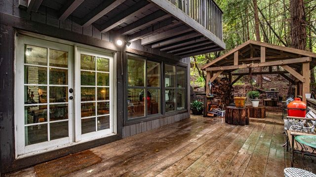 a view of balcony with deck and trees