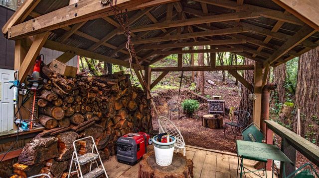 a bathroom with a granite countertop sink toilet a mirror a bathtub and shower