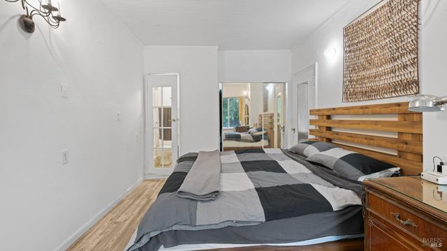 a backyard of a house with lots of green space and fountain