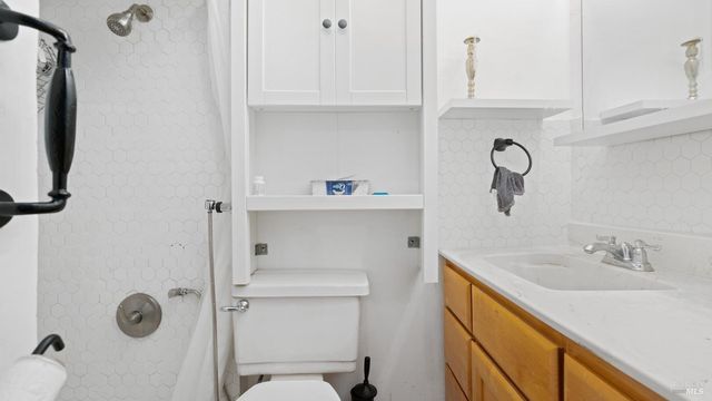 an aerial view of a house with yard