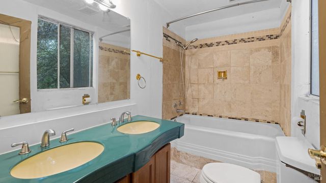 a balcony with wooden floor and outdoor space