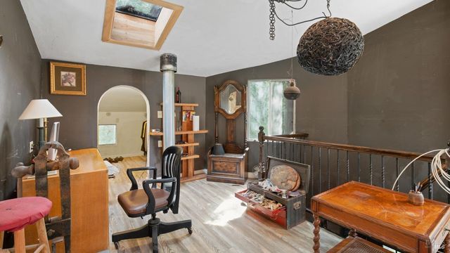 a view of balcony with furniture and trees