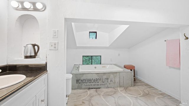 a view of a house with backyard porch and sitting area