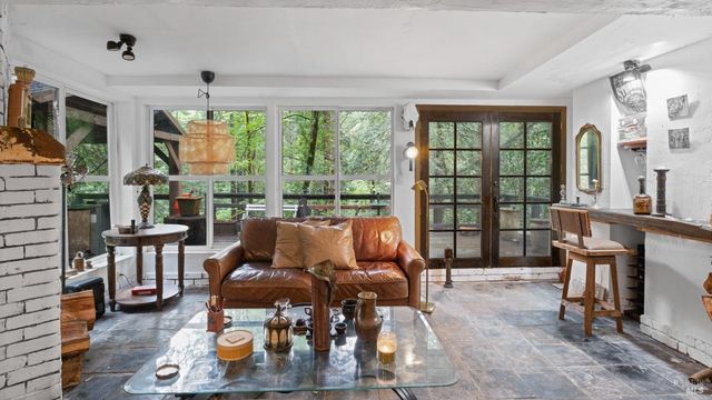 a view of a livingroom with furniture window and wooden floor